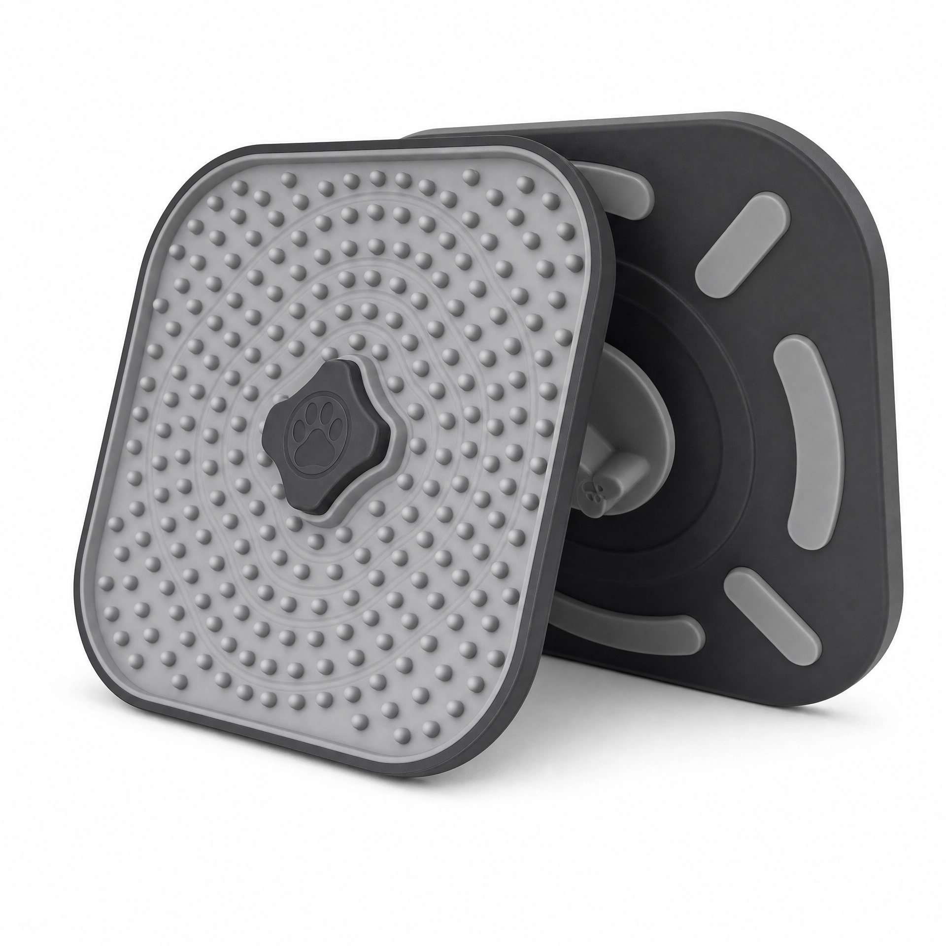 A gray and black silicone dog training mat shown from two angles on a white background, featuring a raised paw print logo in the center. Dog lick mat